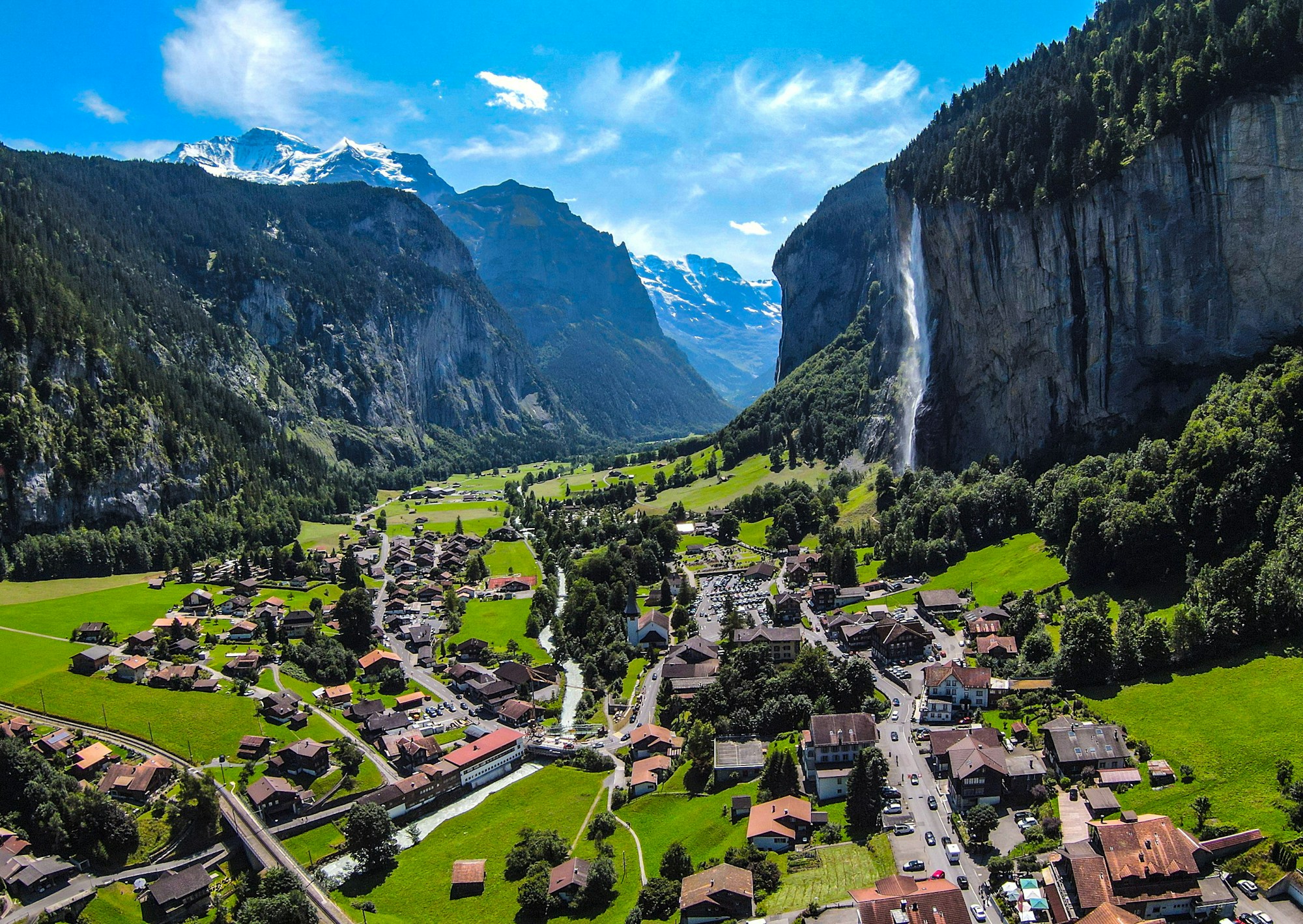 Lauterbrunnen village and waterfall framed by the Swiss Alps